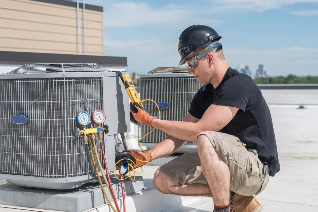 Service technician working on HVAC equipment